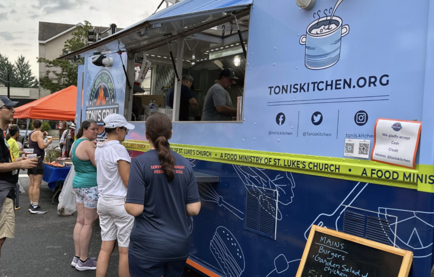Toni's Kitchen food truck serves meals to residents at a community event in Montclair, New Jersey.