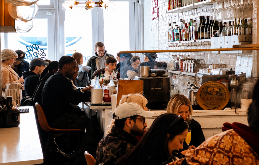 Customers dine at a busy brunch restaurant, illustrating Pig & Butter's upcoming move from New York City to Montclair.