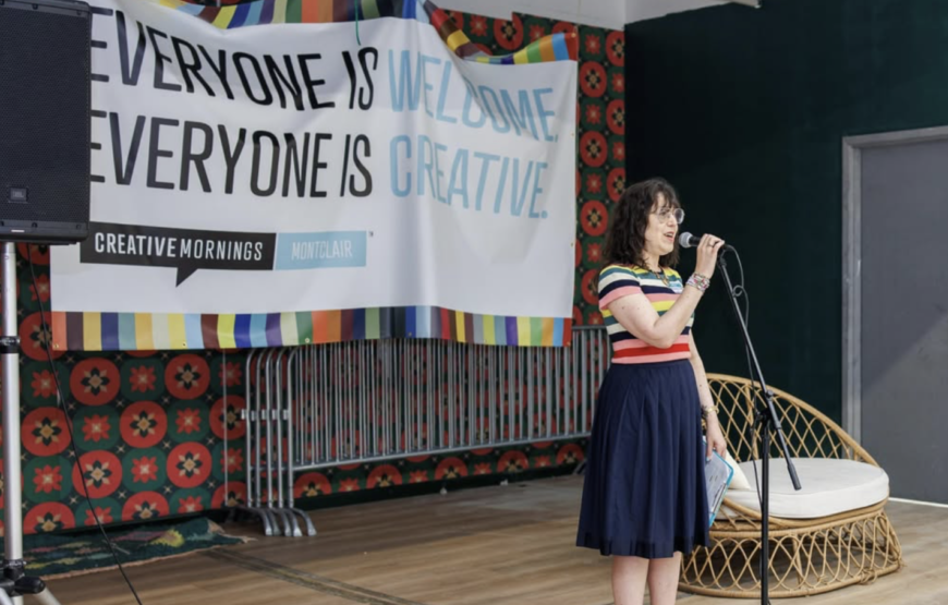 Speaker addressing attendees during a CreativeMornings Montclair event at Lackawanna Station in Montclair, New Jersey.