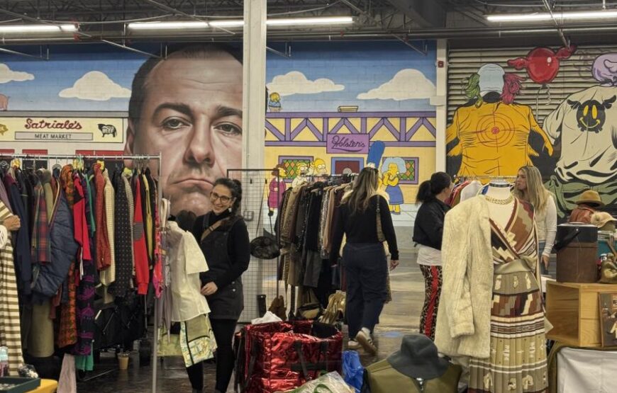 Shoppers browse vintage clothing racks at the Vintage and Record Fair at Lackawanna Station in Montclair, NJ