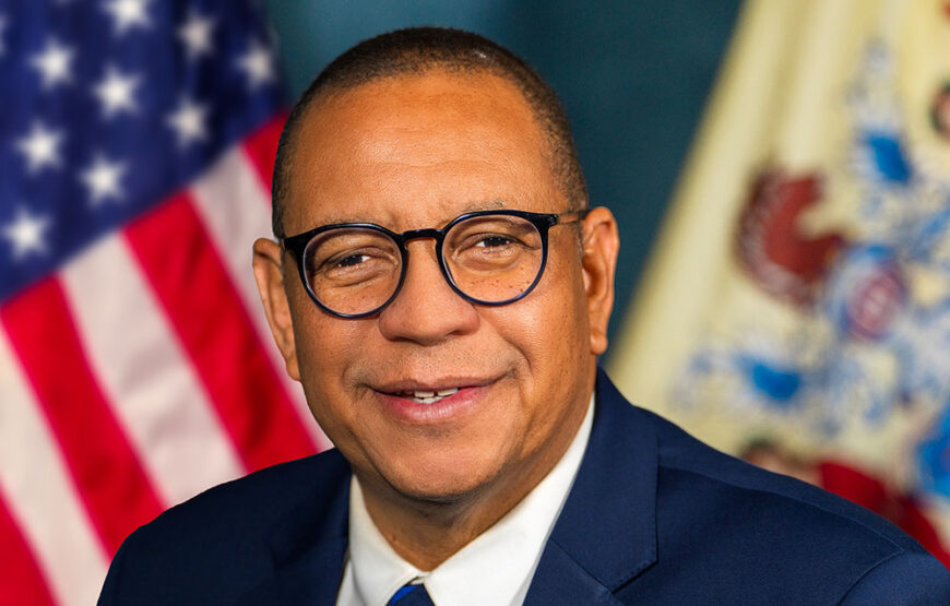 Dale Caldwell, who resigned as New Jersey lieutenant governor, in his official portrait before the U.S. and state flags