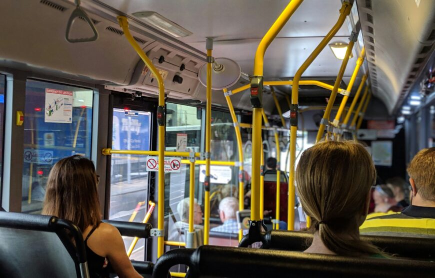 Passengers riding on a city shuttle bus, illustrating Montclair's proposed local jitney service.