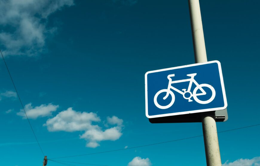 Blue bike lane sign with a white bicycle symbol, illustrating the Glenridge Avenue cycle track plan in Montclair