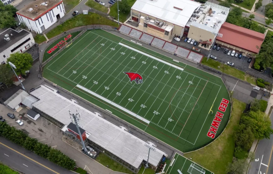 Aerial view of Montclair State University’s Sprague Field with the Red Hawks logo at midfield, home to Montclair sports this weekend